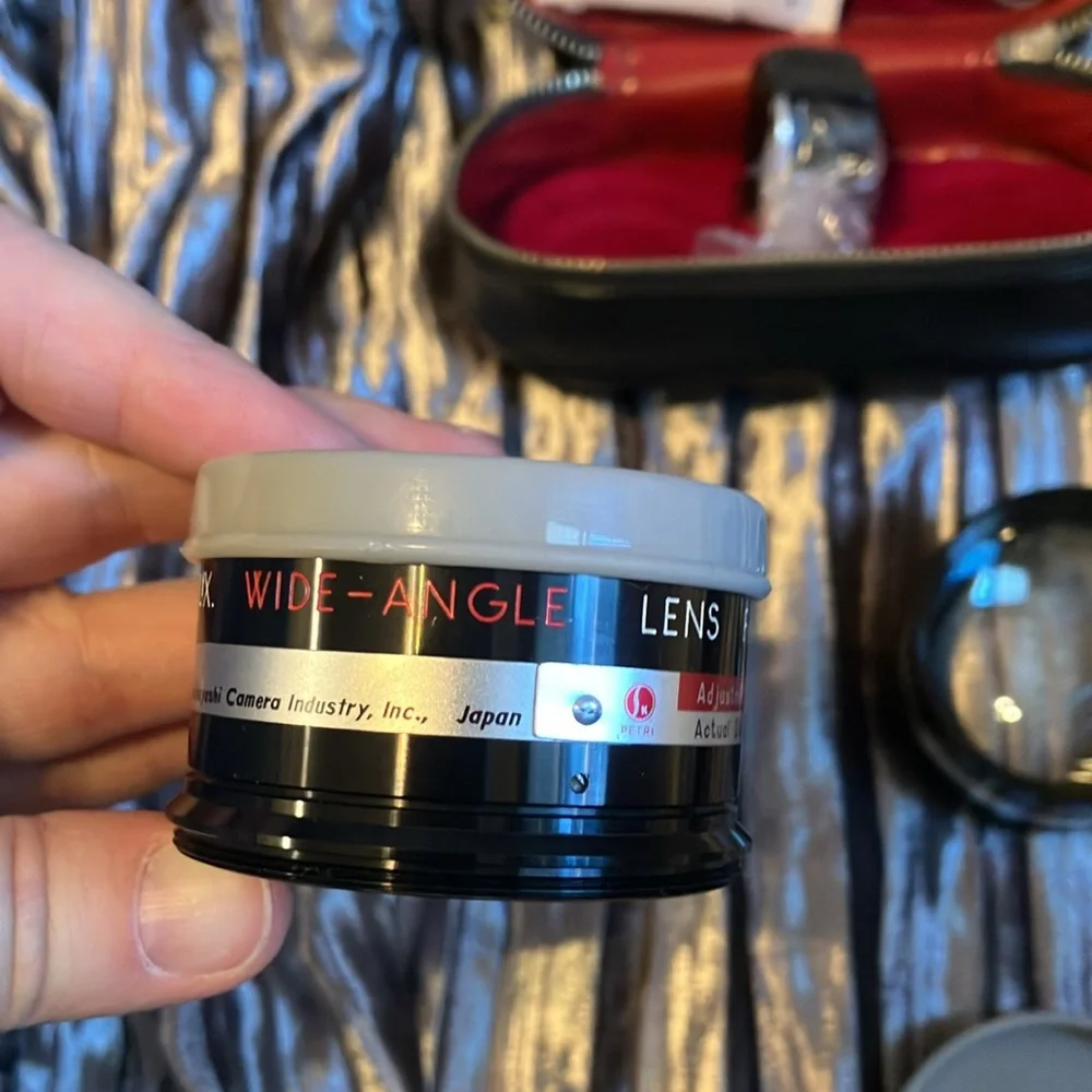 Petri 7 1.8 Camera 35mm, 2 additional Lens, & Popular fan flash reflector